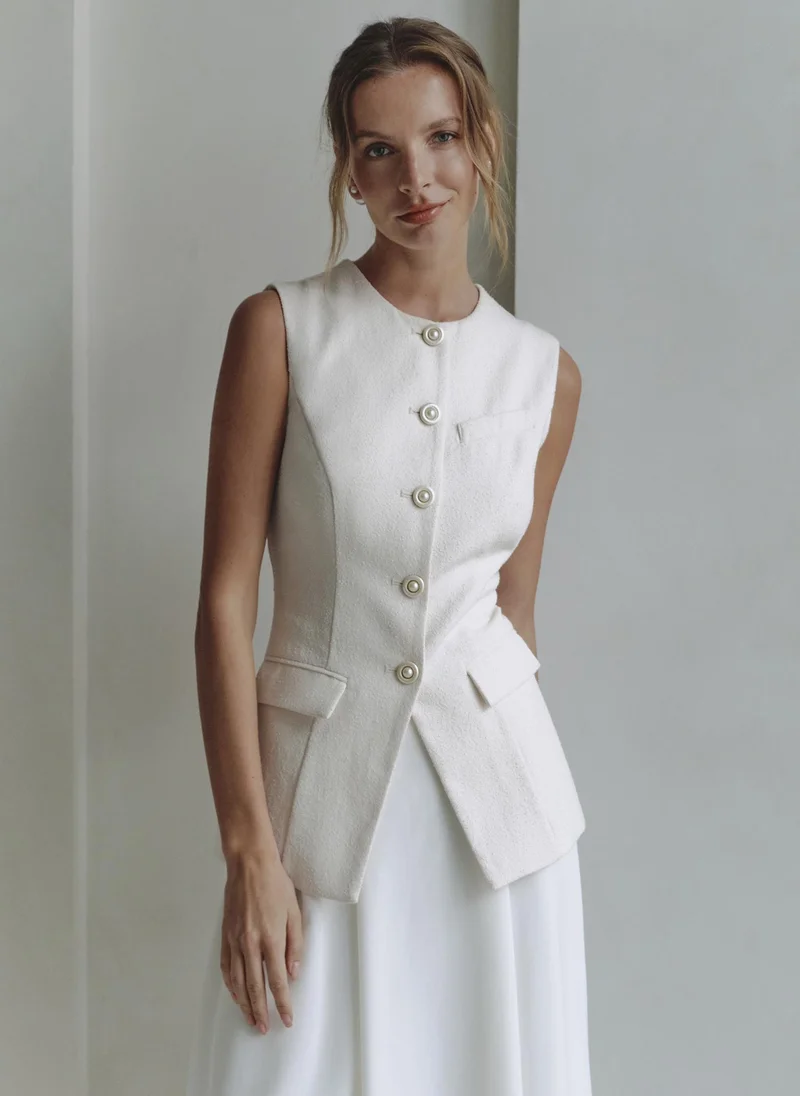 ليتشي صدرية مزودة بأزرار مميزة